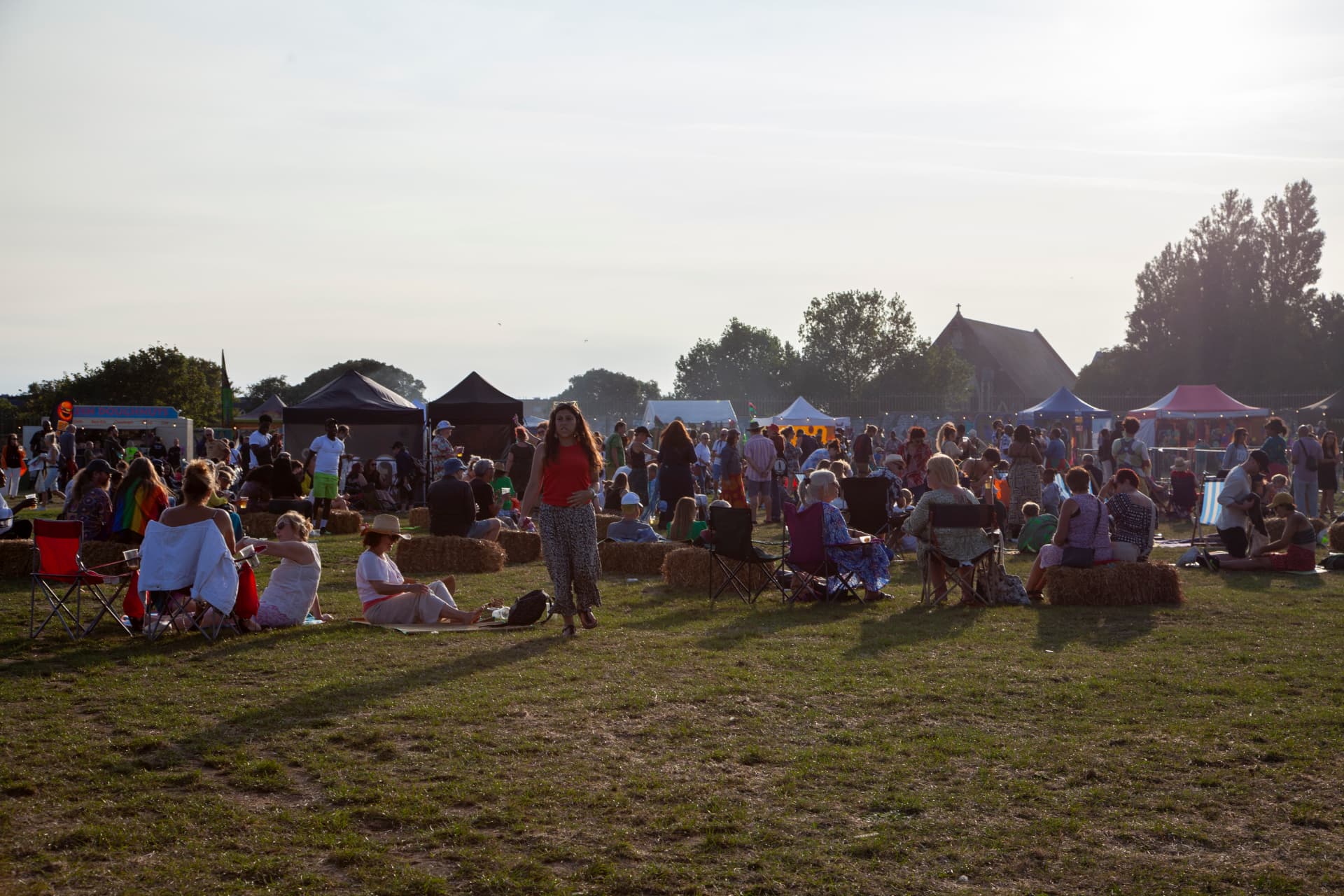 The crowd at the Hidden Beach festival in golden evening light